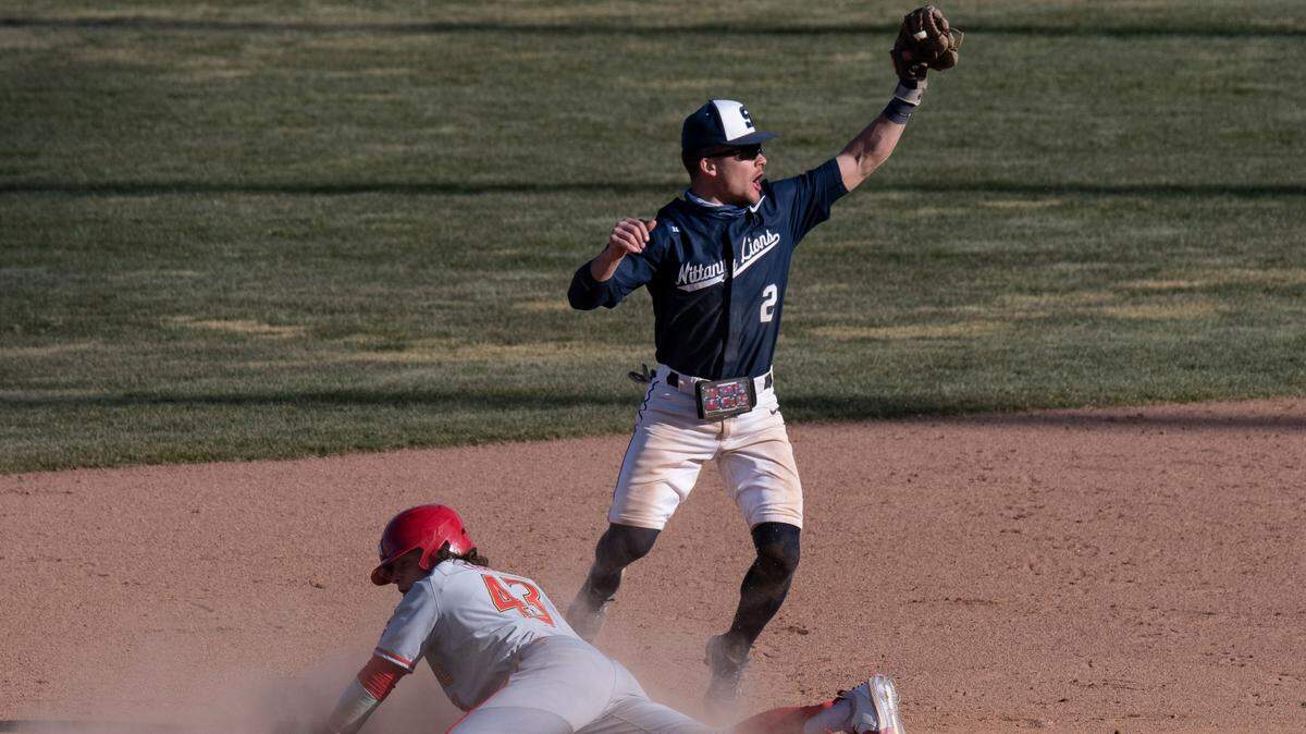 Penn State infielder Gavin Homer (2) holds up the ball as Maryland infielder Austin Chavis (43) slides back to second base during Penn State Baseball’s game against the Maryland Terrapins at Medlar Field on Monday, March 22, 2021 in State College, PA.