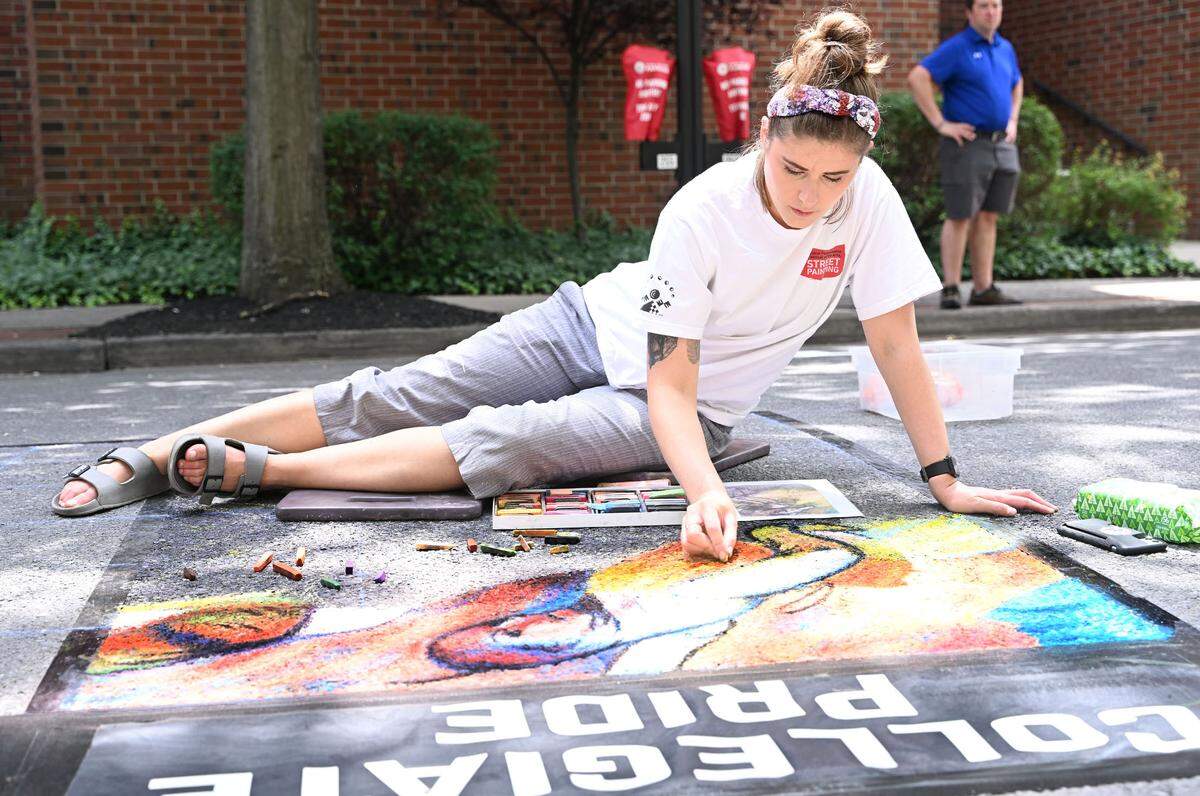 Alison Laninger, 34, of State College reproduces “Group of 3 Dancers” using chalk pastel on Foster Alley during the 57th Central Pennsylvania Festival of the Arts in State College Thursday, July 13, 2023.