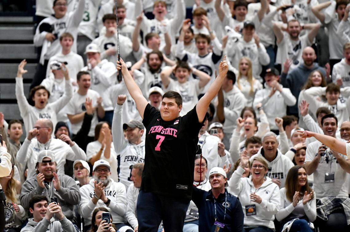 Penn State student Phil Latinski celebrates making a 94-foot putt across the basketball court during the Nittany Lions men’s game against Wisconsin in Rec Hall on Thursday, Jan. 22, 2026. 