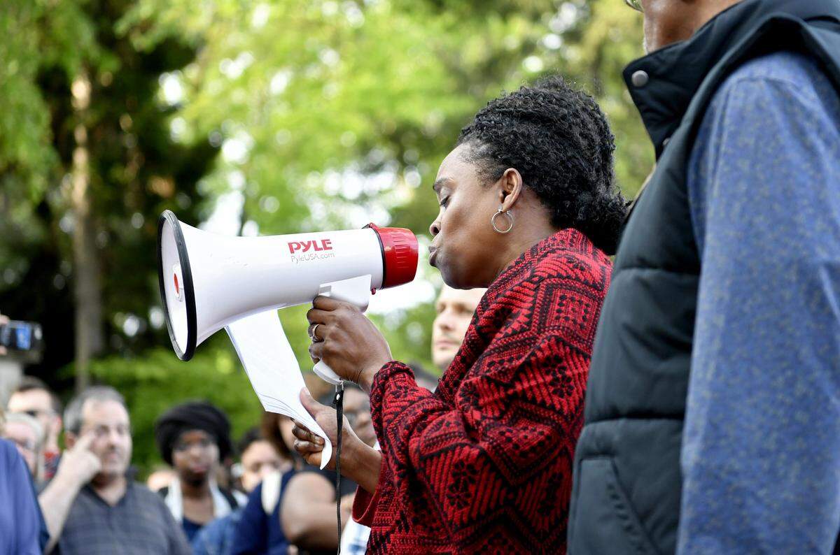 Iyun Osagie, Osaze Osagie’s mother, speaks to the large crowd of community members that gathered to rally in downtown State College on May 8, 2019.