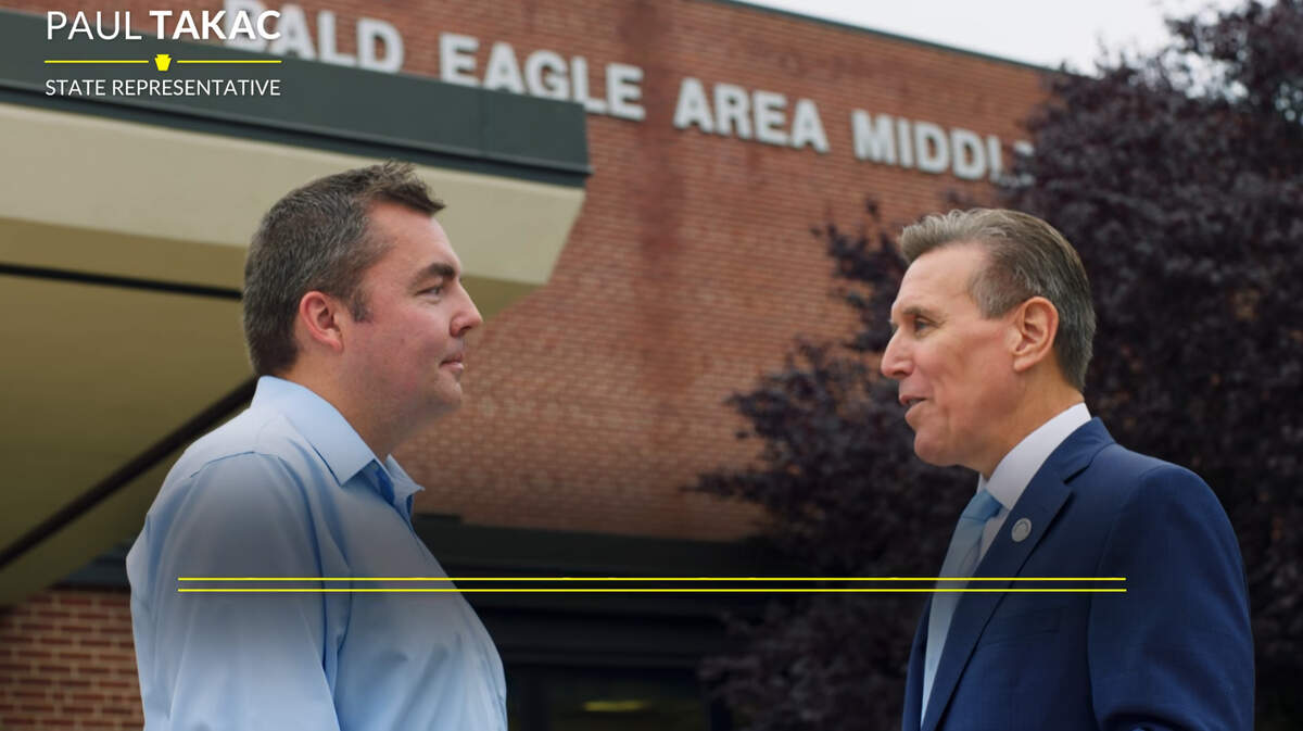 State Rep. Paul Takac and Bald Eagle Area school board member Jason Penland appear outside Bald Eagle Area Middle School in a political ad for Takac’s campaign.