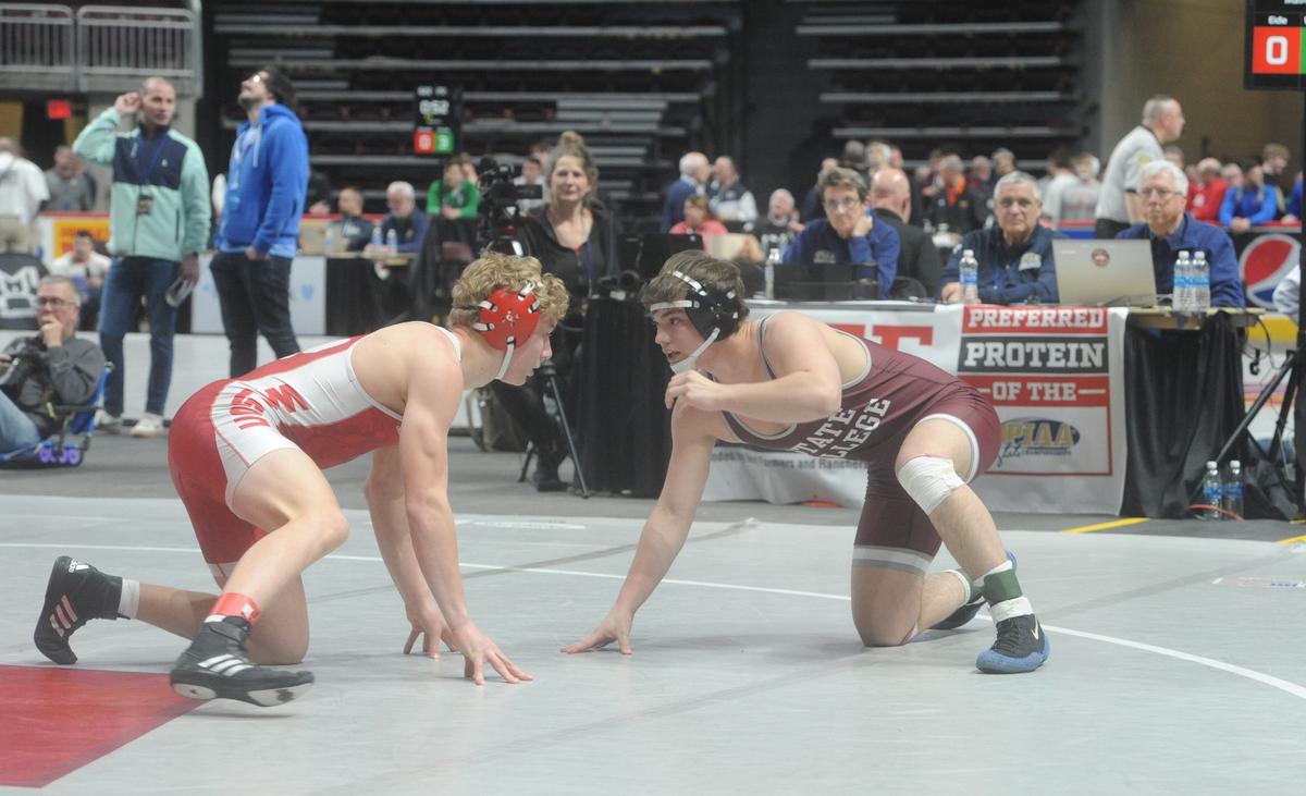 State College’s Carter Weaverling looks for an opening on Wilson’s Blaise Eidle in their 172-pound first round match of the PIAA Class 3A Championships on Thursday, March 9, 2023 at the Giant Center in Hershey. Eidle topped Weaverling, 5-1.