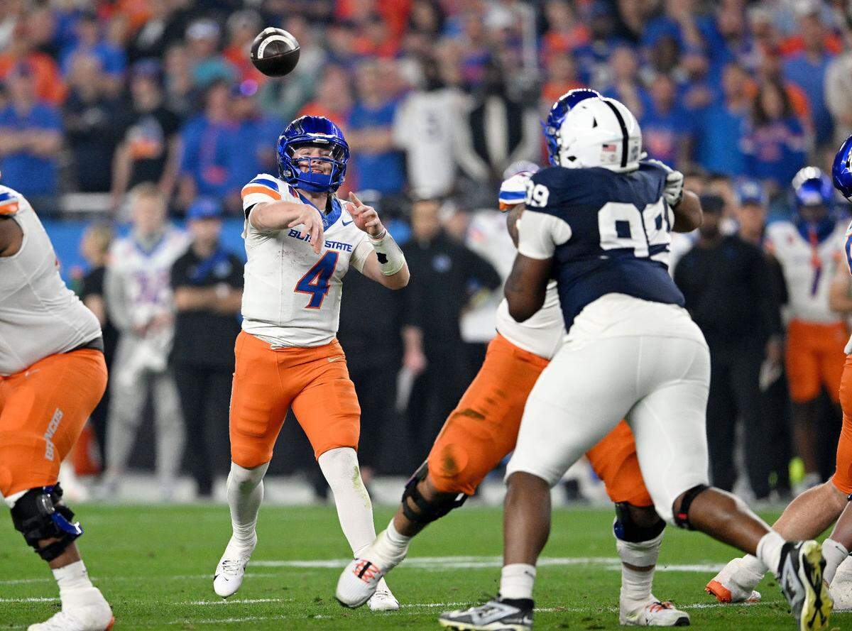 Boise State quarterback Maddux Madsen makes a pass during the Fiesta Bowl on Tuesday, Dec. 31, 2024 at State Farm Stadium.