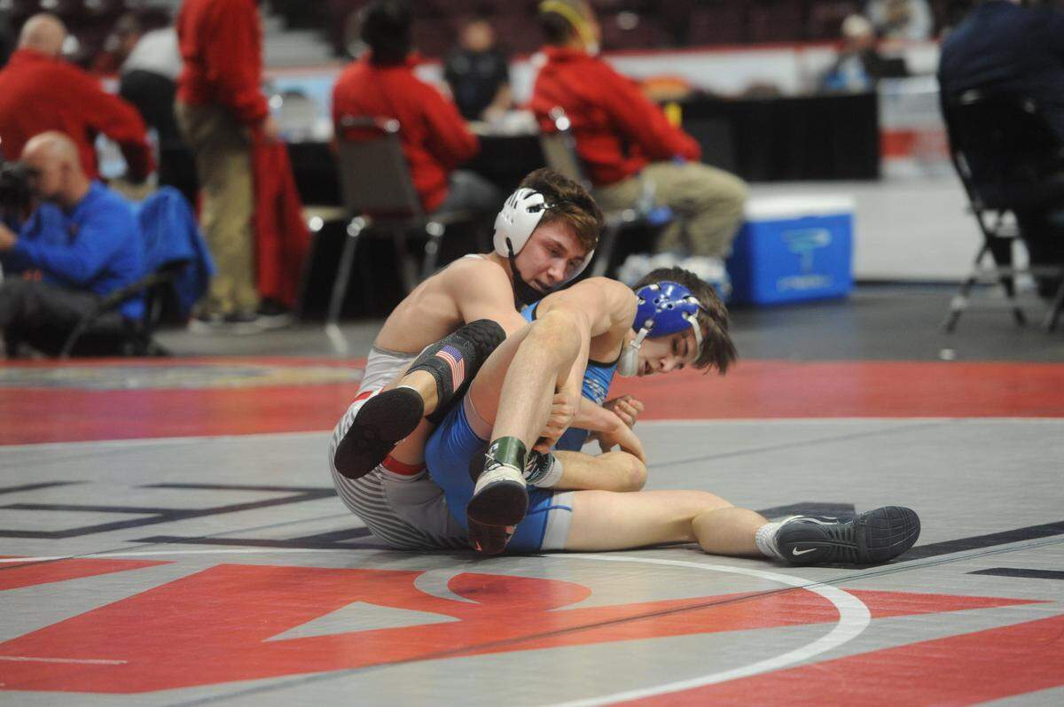 Bellefonte’s Aidan O’Shea controls Hempfield Area’s Eli Carr in their 132-pound consolation second round match of the PIAA Class 3A Championships on Friday, March 11, 2022 at Giant Center in Hershey. Carr edged O’Shea, 2-1, to end O’Shea’s high school career.