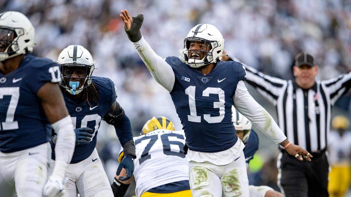 Penn State linebacker Ellis Brooks celebrates after a turnover during the game against Michigan on Saturday, Nov. 13, 2021.