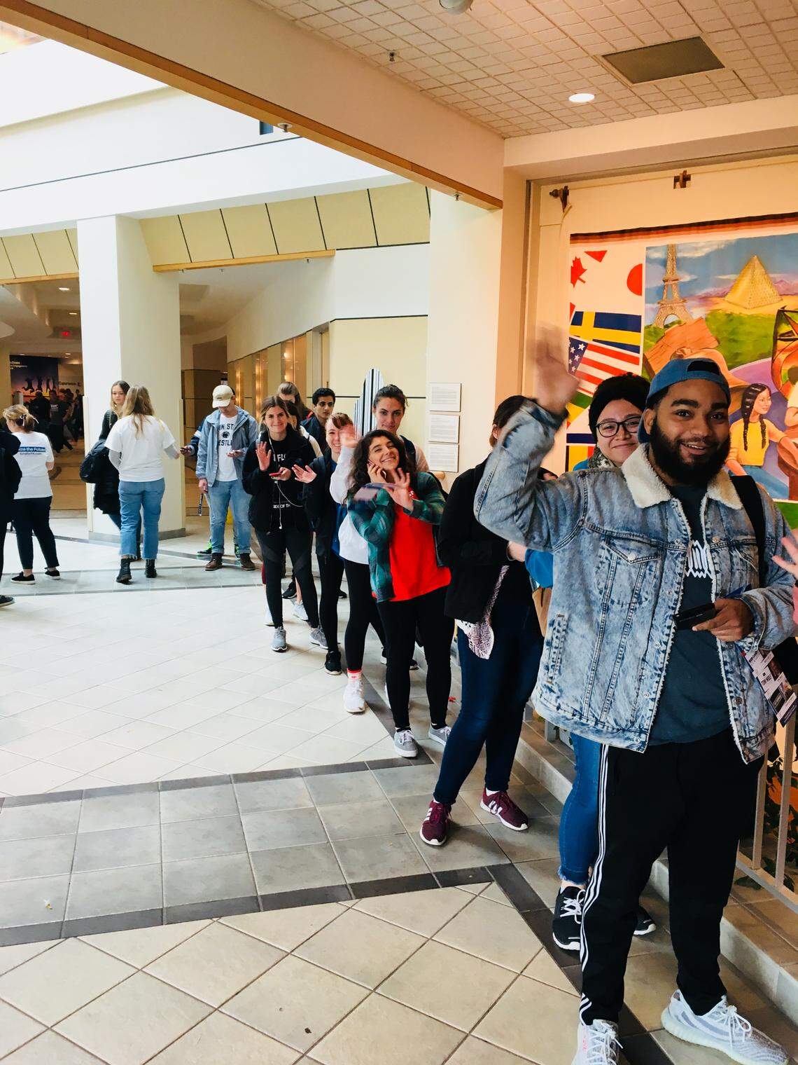 A line of Penn State students stretches down the hallway outside the polling place in the HUB on Tuesday. Penn State students had record voter turnout in the 2018 midterm election, according to unofficial vote tallies.