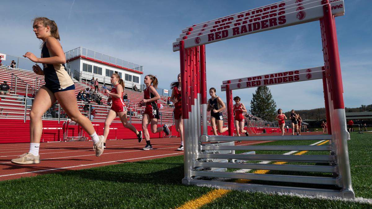 Girls run in the 1600 meter race during a track meet at Bellefonte High School on Tuesday, March 30, 2021 in Bellefonte, PA.