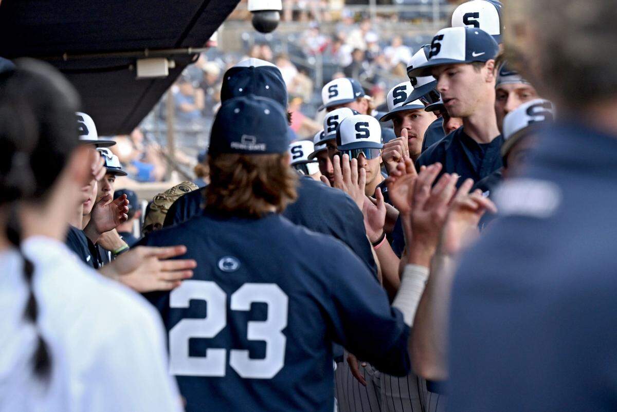 Penn State baseball players high-five in the dugout during the game against Rider on Wednesday, April 30, 2025 at Medlar Field.