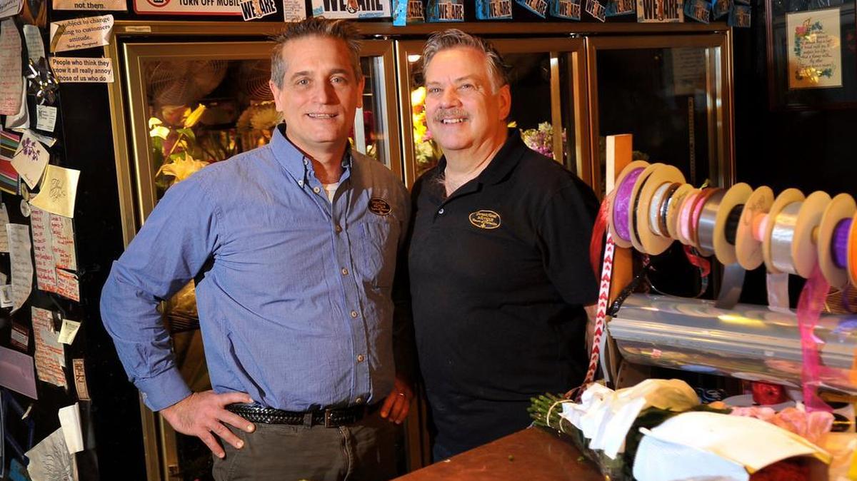 Mitchell Ballas, left, and Randy Ammerman have owned George’s Floral Botique in State College for 25 years .