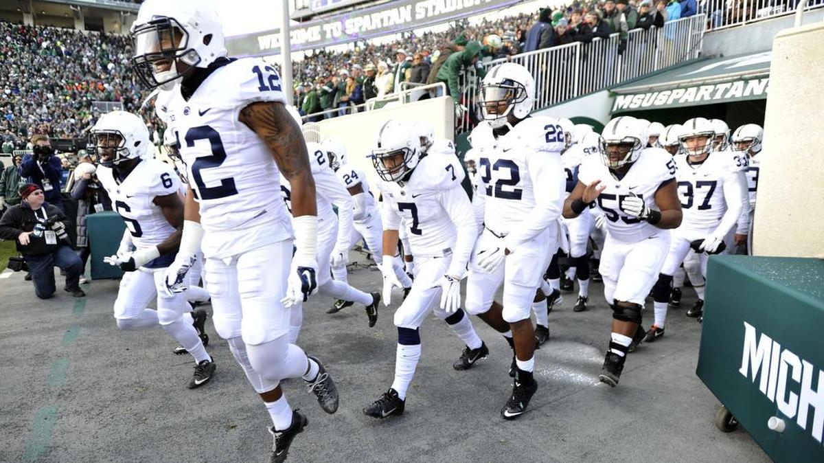 Penn State enters the field against Michigan State during a football game in East Lansing, Mich., in 2015.