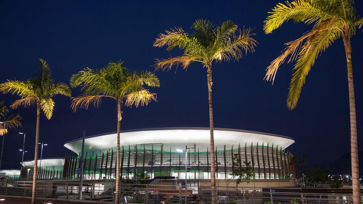 The Carioca Arena 1 is seen behind palm trees at the Rio 2016 Olympic Park in Rio de Janeiro.