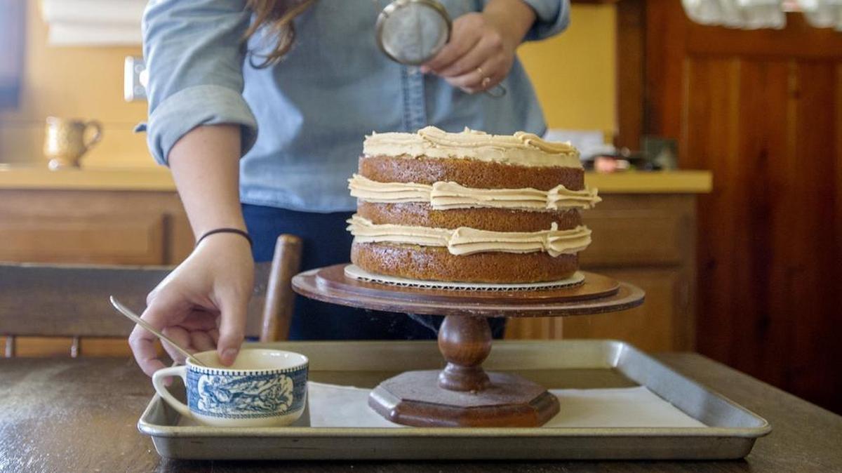 Sam Doan puts the finishing touches on a pumpkin spice cake on Nov. 15. Doan and her fiance, Mark Ardry, started The Bacrey, using local ingredients for their baked goods, which are sold at farmers markers.