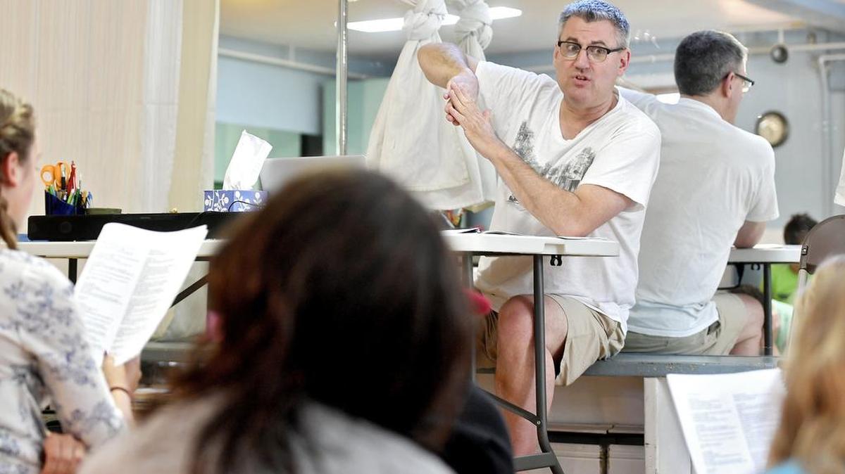 Richard Biever goes over the lyrics and history in “Hamilton” during Singing Onstage’s Camp Hamilton on Wednesday.