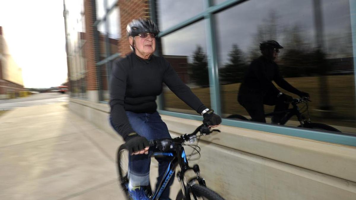 Alex Murnyack rides his new bicycle through the Penn State campus on March 1. Murnyack, 73, of Clarence, had open heart surgery in 2014. Since then he has been riding his bike almost every day to stay in shape logging more than 5,000 miles since the surgery.