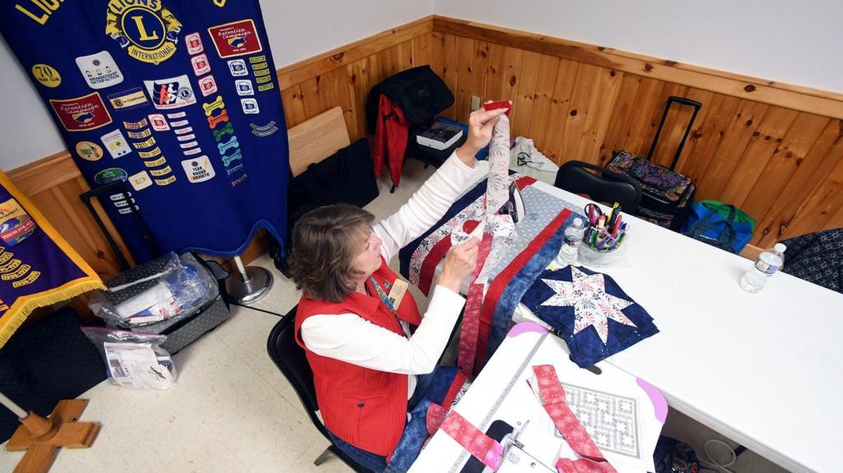 Gloria Baney sews strips of fabric during a May 8 Happy Valley Quilts of Valor sewing day at the Centre Hall America Legion.