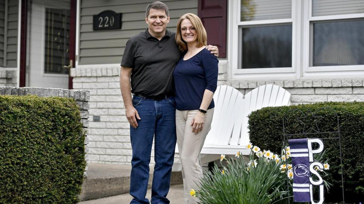 Tom and Paula Brown pose on the porch of their Doris Avenue home in State College.