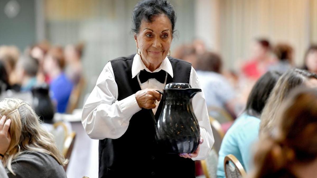 Ruth Hartman serves an event on Thursday at the Ramada Conference Center and Hotel in State College.