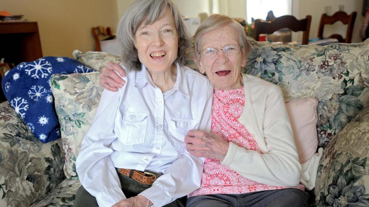 Irene Hornak, 98, holds her daughter Ruth as they laugh about their life together in their apartment at Juniper Village on Tuesday.