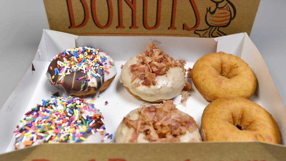 Selections at Duck Donuts in State College include Beach Ball, Maple Bacon and plain doughnuts.