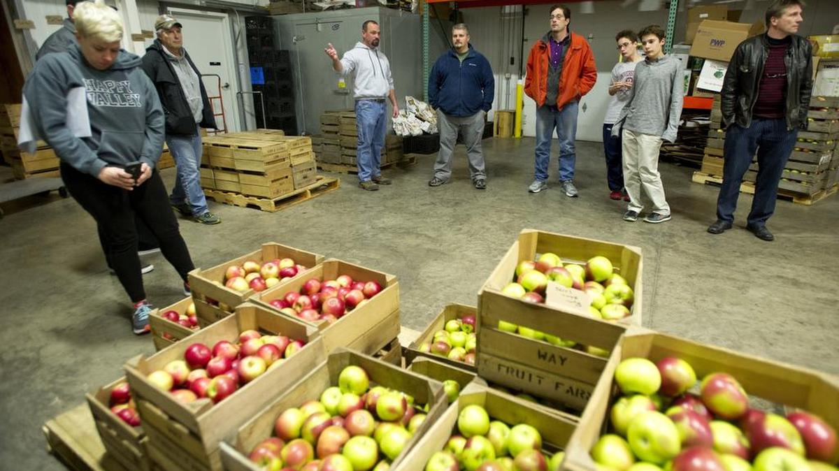 Jason Copey, owner at Way Fruit Farm, gives a tour of the apple facility during a meeting of the local chapter of the American Culinary Federation on Nov.