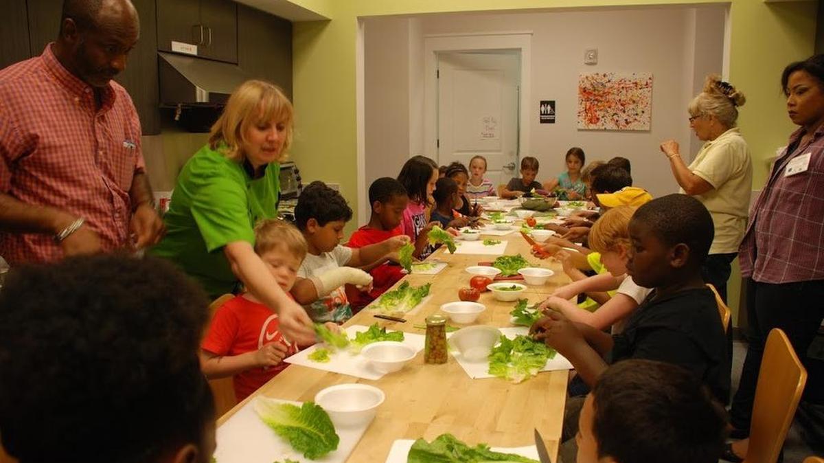 Kids prepare a chopped salad at a South Carolina 4-H Healthy Lifestyles Cooking Camp in Beaufort County, S.C.