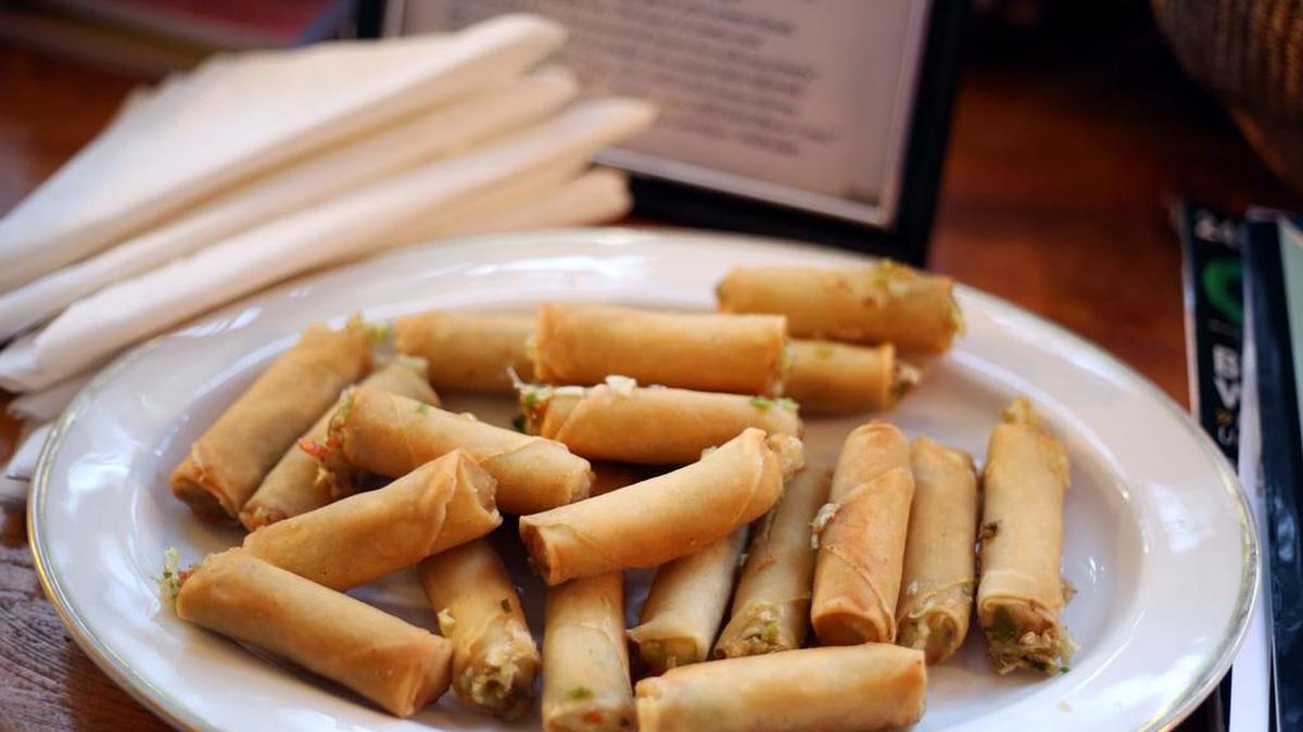 Vegetable egg rolls are prepared during the April 1 Twilight Dinner in Lemont.