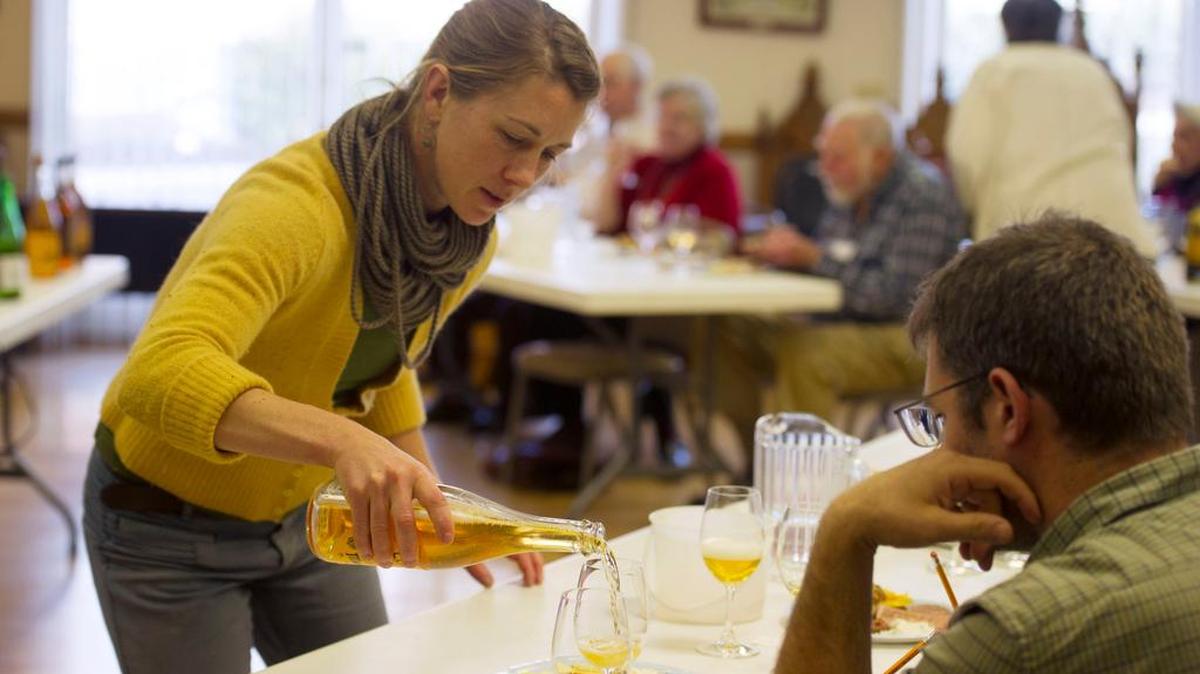 Melissa Madden, of Good Life Cidery, pours cider during a meeting of the Mount Nittany chapter of the American Wine Society on Jan. 15 at Windmere Hall.