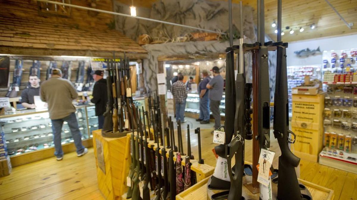 Hunters register for their hunting licenses and get ready for the first day of the season at Belding and Mull in Philipsburg on Nov. 28.