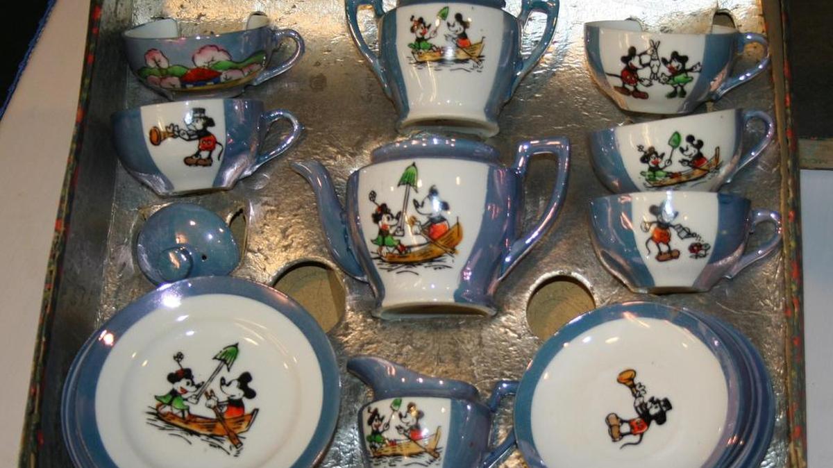 Pictured is a circa 1930s ceramic Mickey Mouse child’s tea set in its original box. It is important to keep the box an item came in, but delicate items like china should not be stored in cardboard boxed.