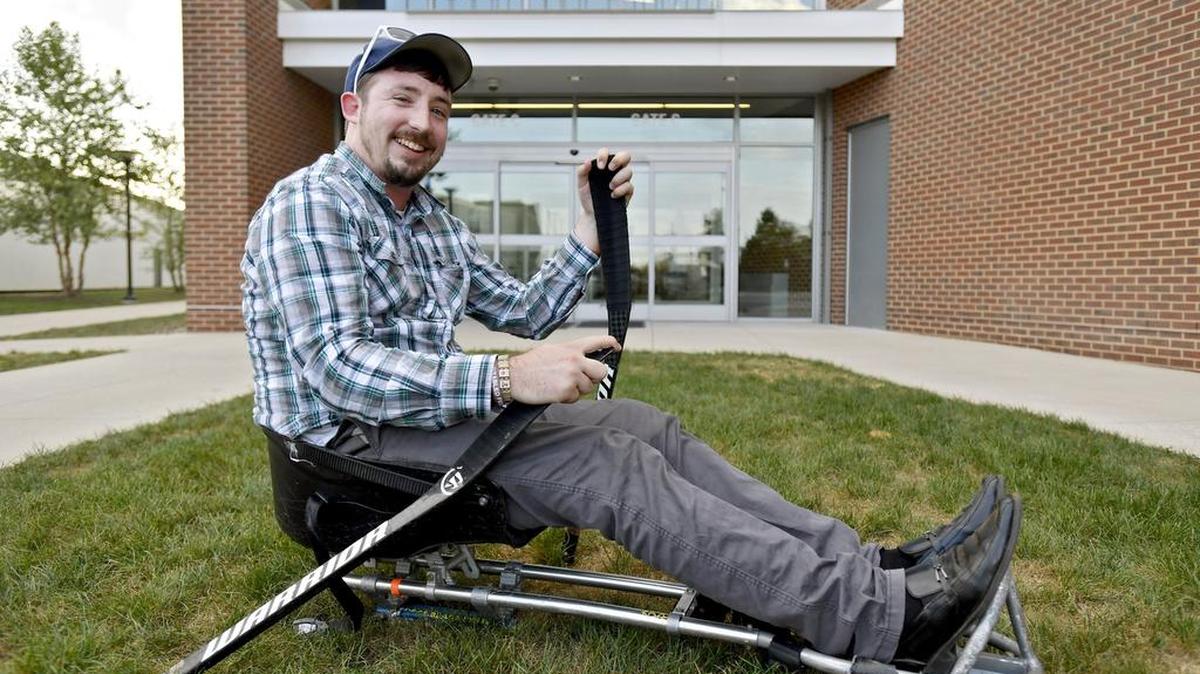 D.J. Wilson, head coach of the State College Sled Hockey team, shows off his sled on Wednesday outside of Pegula Ice Arena.