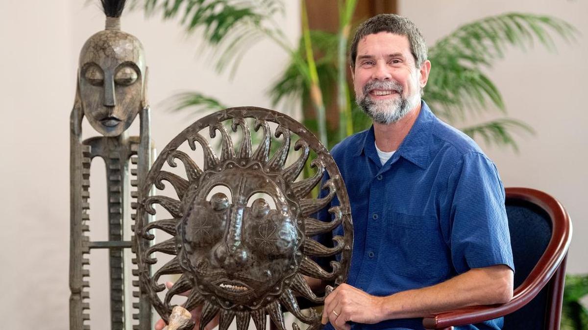 Joel Weidner, posing with some handicrafts from Ten Thousand Villages in the University Mennonite Church on Friday, has spearheaded an effort to bring a store to State College.
