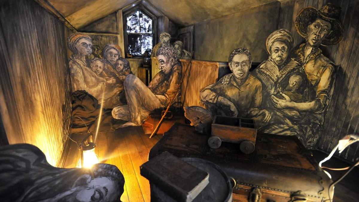 An installation by artist Lino Toyos is part of the Bellefonte Art Museum’s exhibit on the Underground Railroad, which is in a room believed to have housed people along the Underground Railroad.