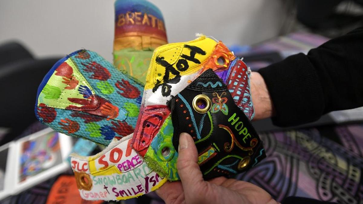 Nancy Vicere holds finished pieces for a Stomper Project in April 2016.
