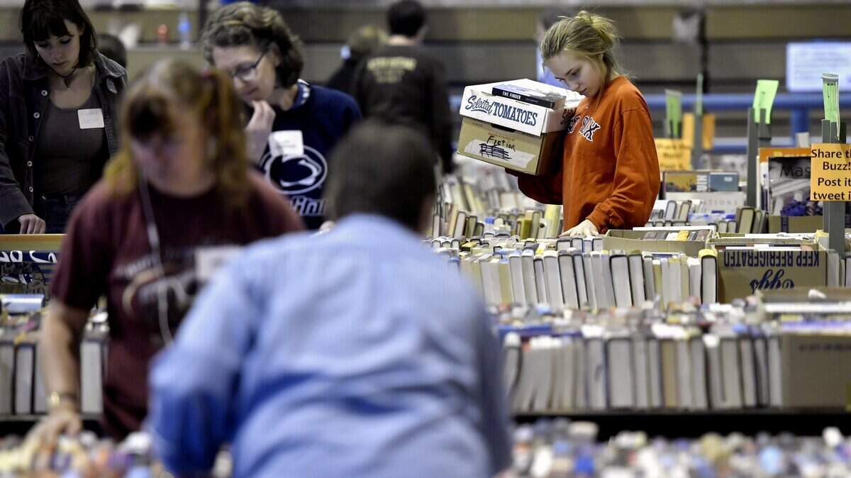 Volunteers organize thousands of books for the 2017 AAUW book sale.