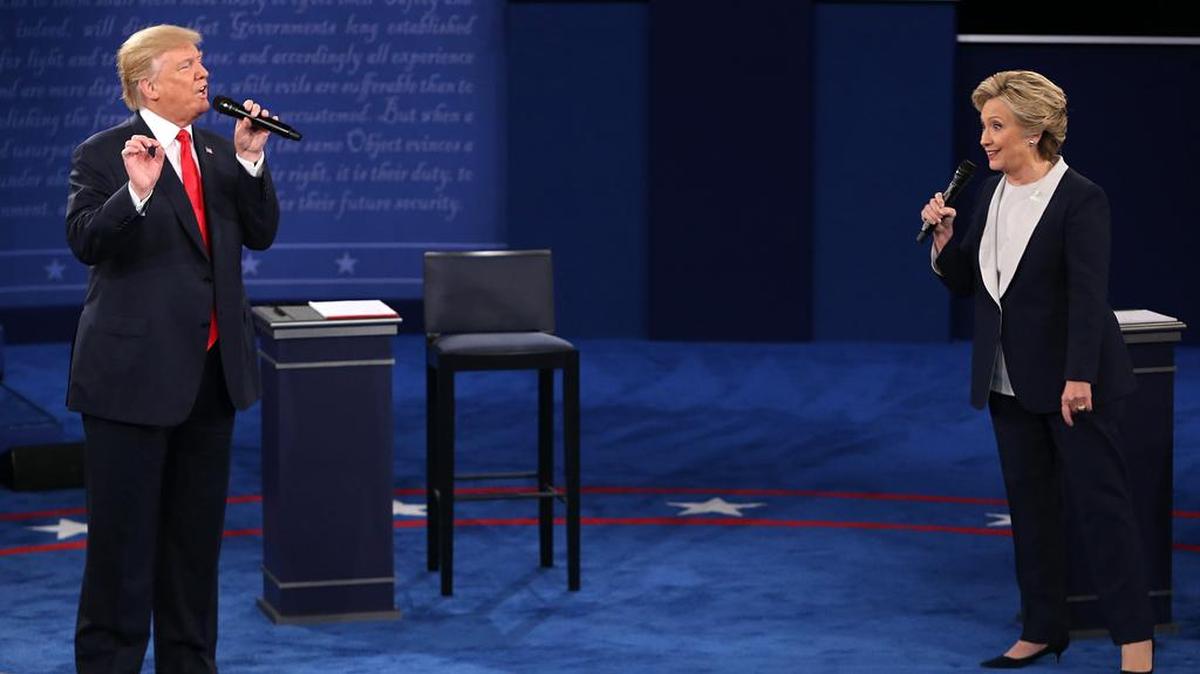 Republican Donald Trump and Democrat Hillary Clinton on stage during the second debate between the presidential candidates on Oct. 9.
