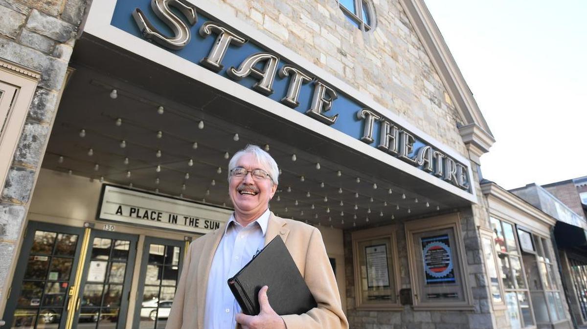 Tony Lentz stands for a portrait with his copy of “A Christmas Carol” Tuesday at The State Theatre. After 40 years, Lentz will be performing the Charles Dickens classic this December for the last time.
