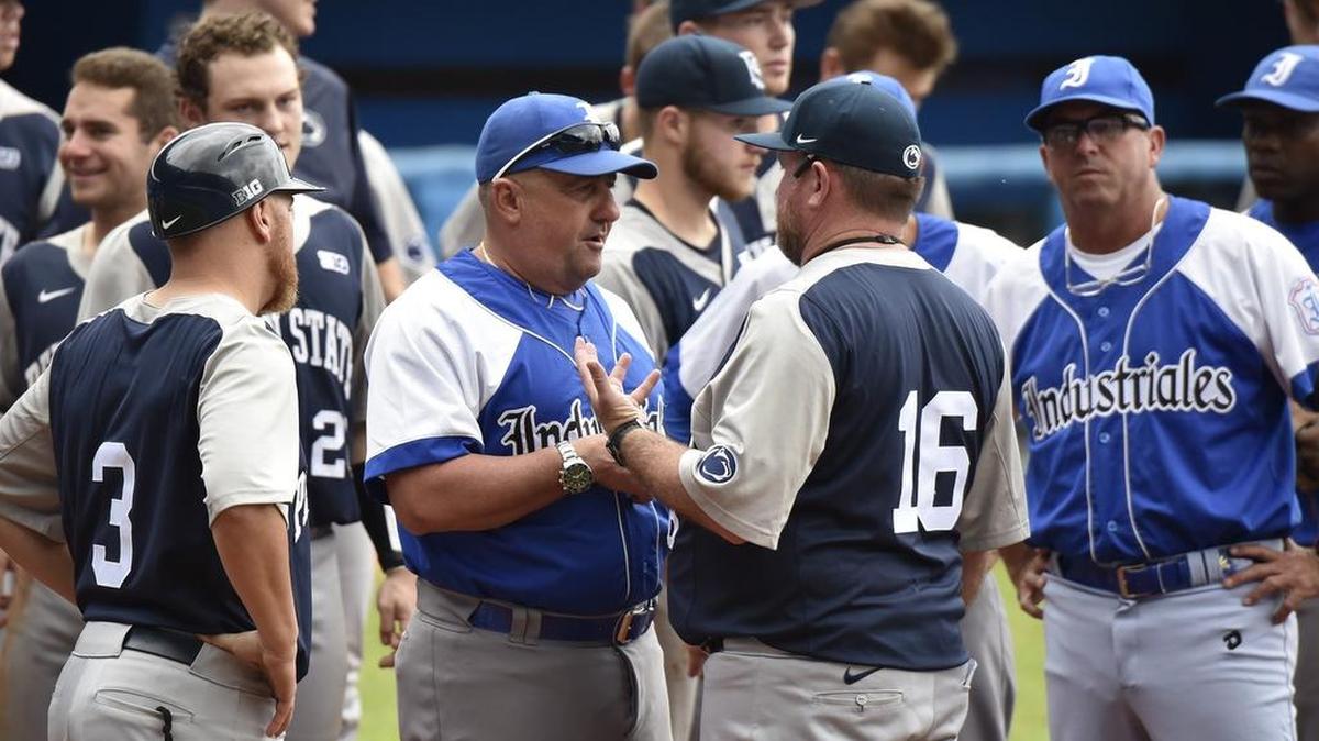 Penn State head baseball coach Rob Cooper (16) talks to Industriales’ coach Javier Mendez after the Nittany Lions’ 2-1 loss at at Latin American Stadium in Havana, Cuba on Nov. 22. 2015.