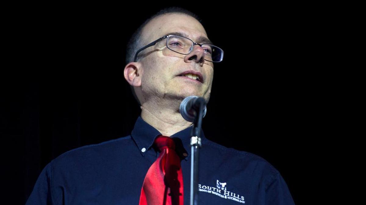 Paul Mazza, president of South Hills School of Business and Technology, tears up while speaking before the screening of “Becoming Bulletproof” on Tuesday at The State Theatre.