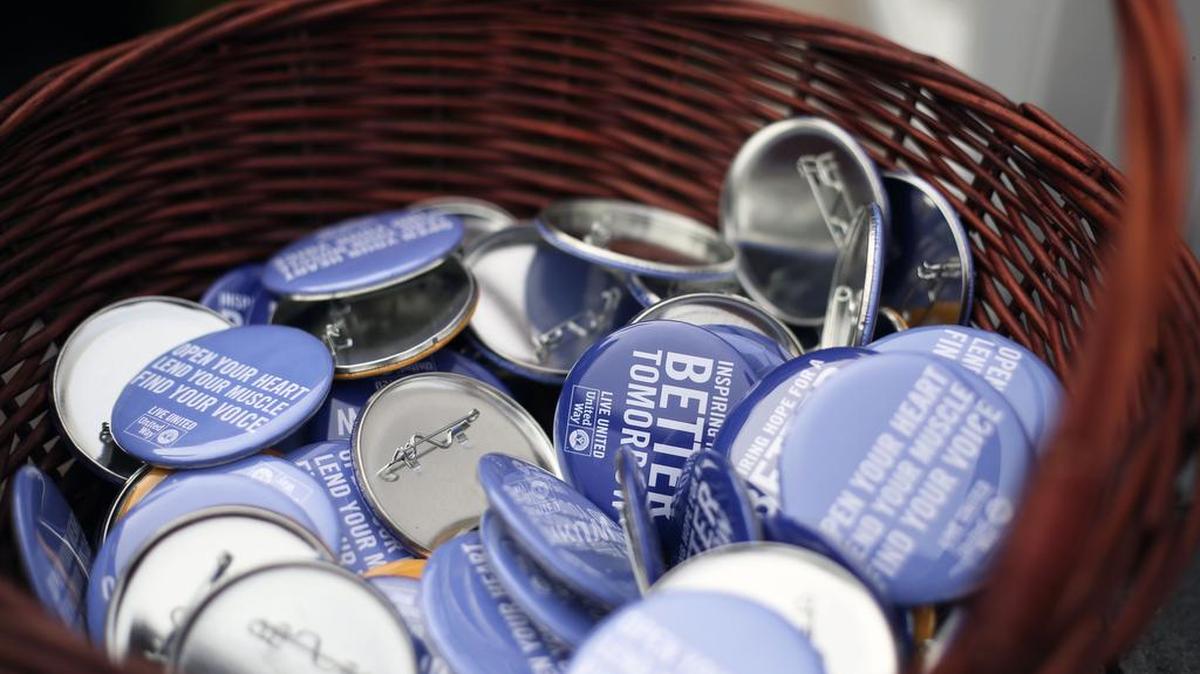 Live United buttons are displayed during the 2016 United Way campaign kick-off event on Tuesday at Housing Transitions. This year, United Way is focusing on partner agencies working together toward community goals.