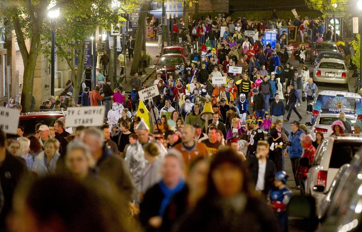 Costumes of all shapes and sizes make their way down Allen Street during the 2014 Centre Region Parks and Recreation Halloween Parade.