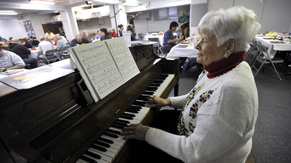 Hope Coder plays Christmas carols during the Community Christmas Day Dinner at the State College Presbyterian Church in 2015.