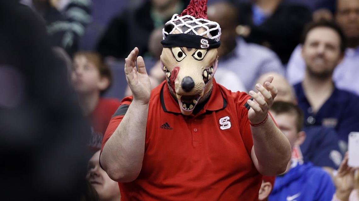 A North Carolina State fan cheers during the game against Wake Forest on Tuesday in Washington. NC State won 75-72.