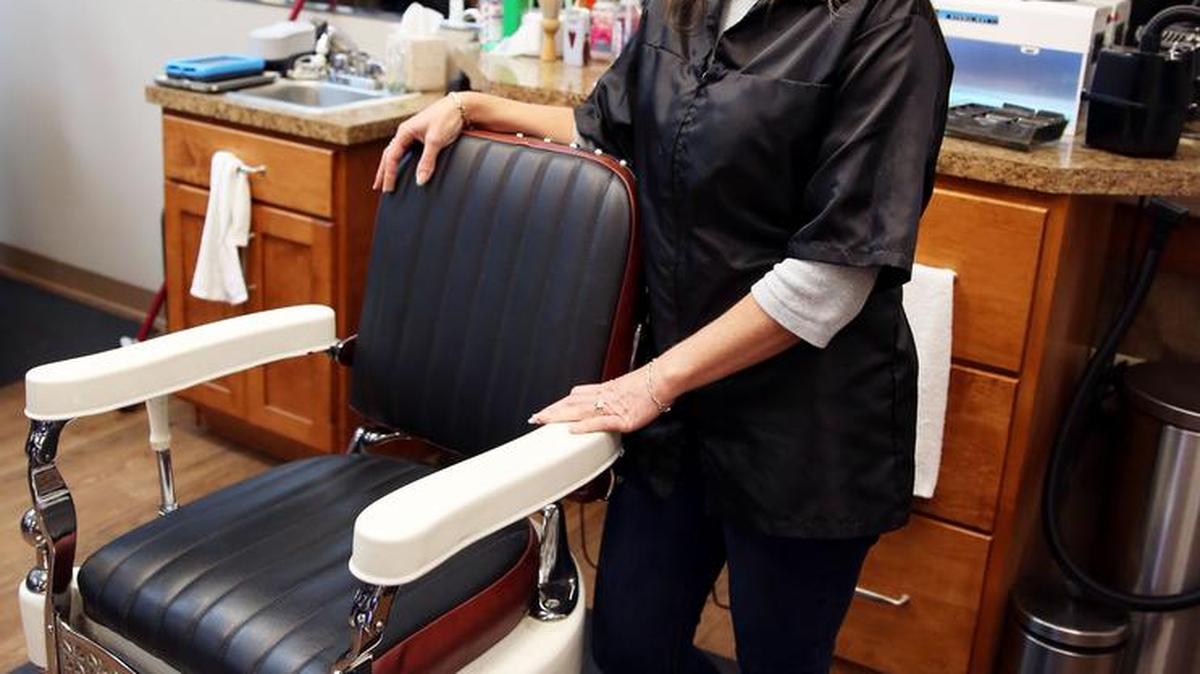 Owen’s Barber Shop owner Becky Trate stands for a photo on Feb. 27 in the Colonnade Boulevard location. A second location will open in Bellefonte this spring.
