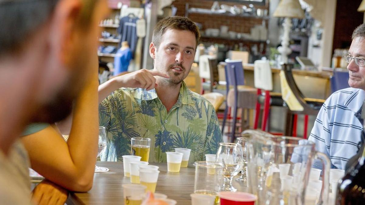 Certified beer judge and State College Homebrew Club member Drew Wham goes over the many different flavors of brewing and the possibilities of things going wrong during the clubs monthly meeting at Big Spring Spirits in Bellefonte on June 29.