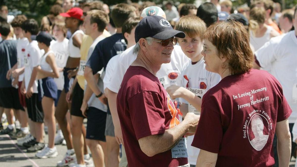 Jeremy Herbstritt’s father, Michael, and his wife, Peg, talk before the start of the first Jeremy Herbstritt Memorial 5K Run/Walk on the University Park campus in 2007.