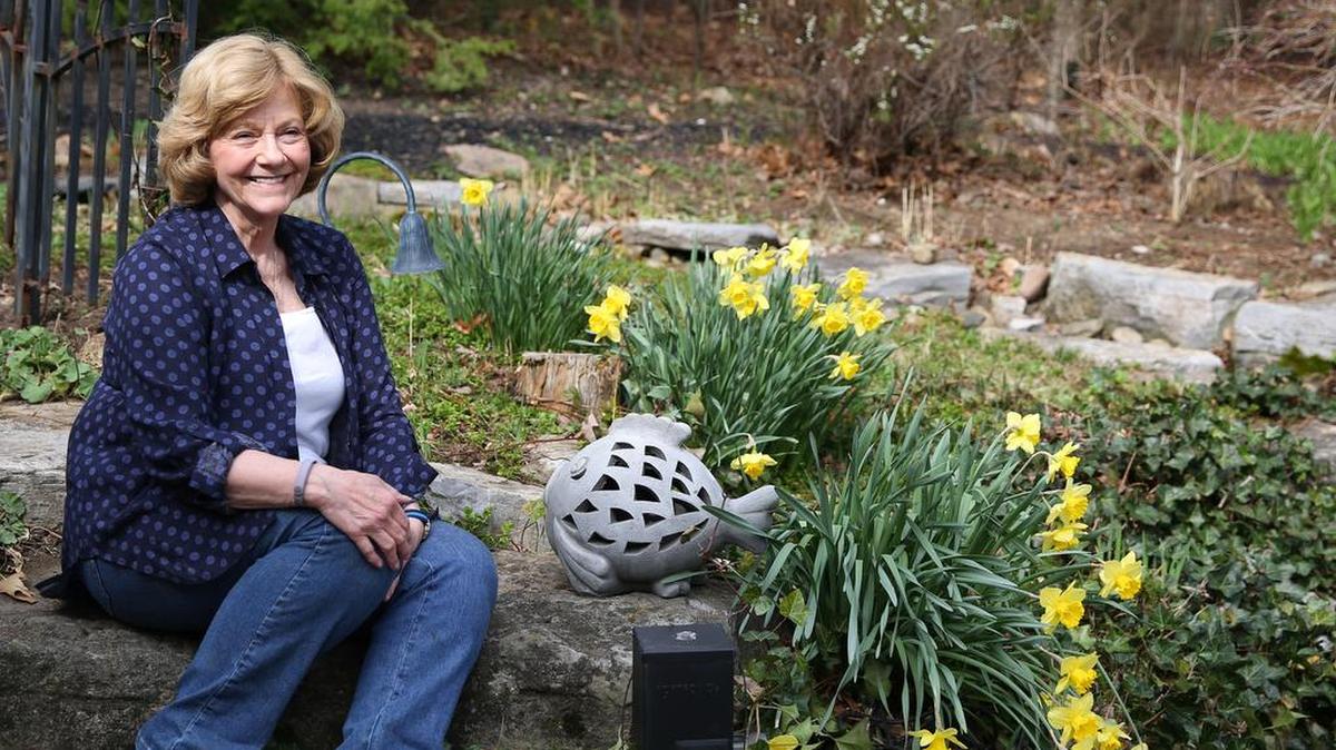 Master Gardener Bonnie Walter sits for a portrait in her garden on April 11 in State College.