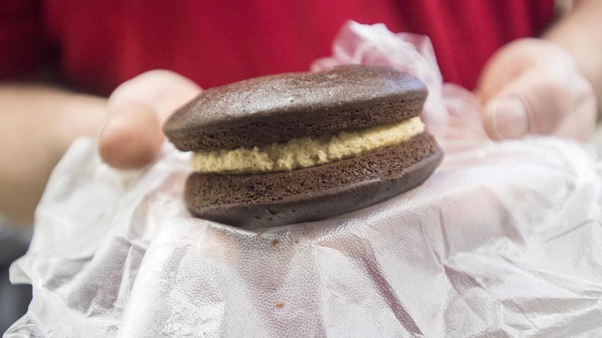 Jim Harper shows off his chocolate peanut butter whoopie pie Wednesday. The dessert recently took first place in the Greatest Whoopie Pie Contest at the Pennsylvania Farm Show.