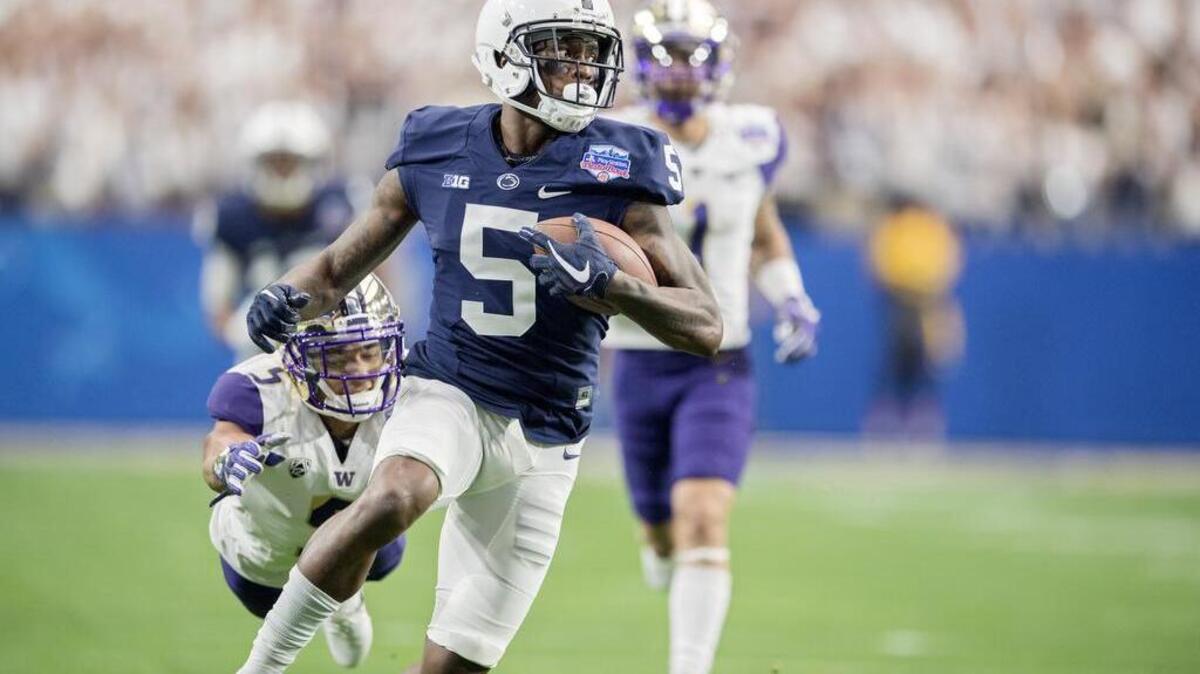 Penn State wide receiver DaeSean Hamilton makes a catch and runs it in for a touchdown ahead of Washington defenders during the 2017 Fiesta Bowl.