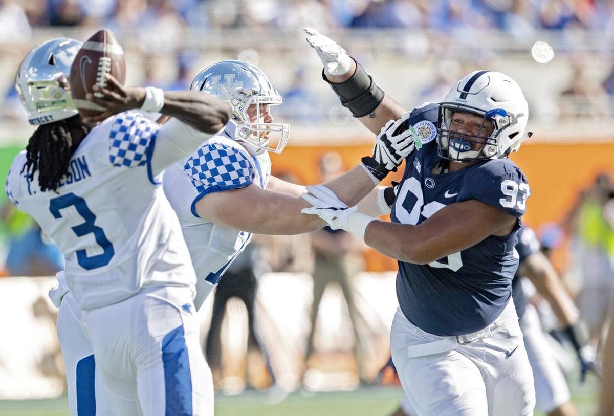 Penn State defensive tackle PJ Mustipher tries to pressure Kentucky quarterback Terry Wilson during the Citrus Bowl on Tuesday, Jan. 1, 2019 at Camping World Stadium.