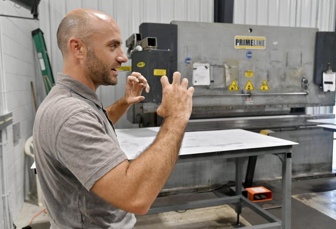 DiamondBack co-owner and co-founder Ethan Wendle explains the process of creating truck covers in the company’s facility in the Moshannon Valley Regional Business Park in 2017.